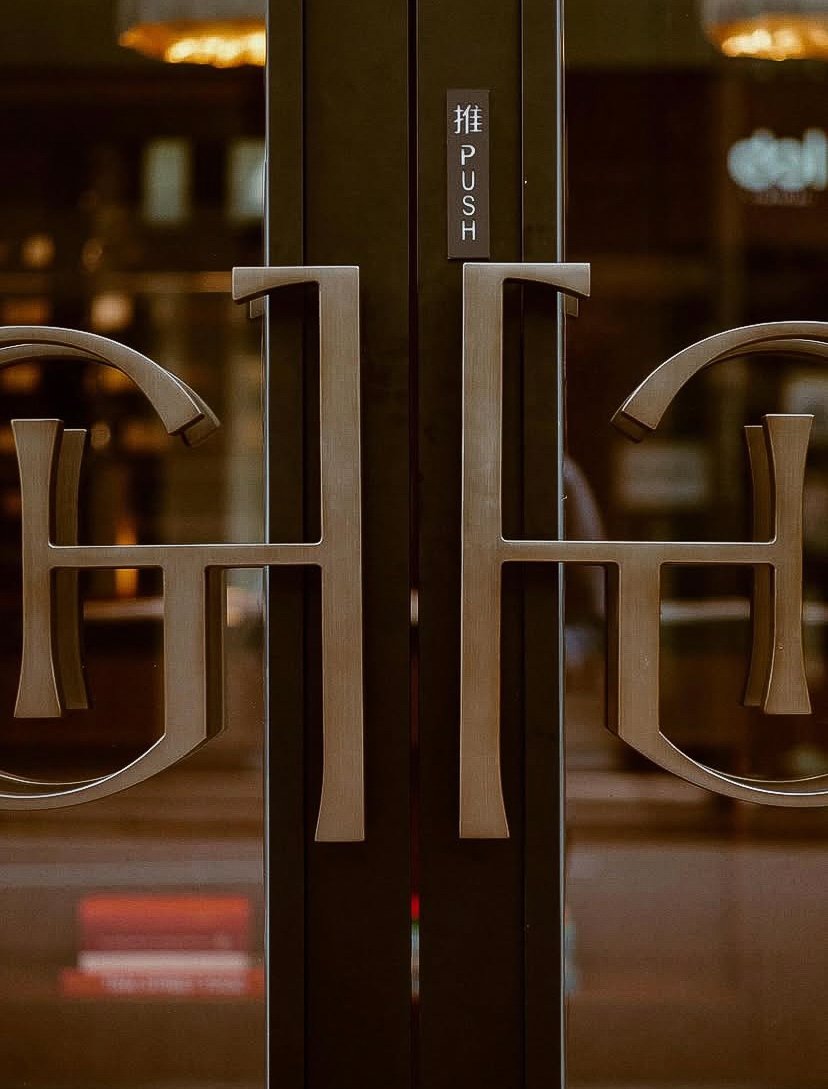 House of Great Treasure monogram brand mark design for luxury kitchen showroom as storefront door handles