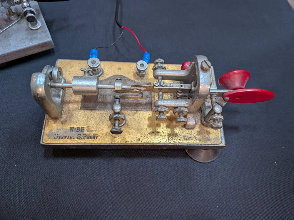 Historic mechanical Morse key labeled W1BB Stewart S. Perry