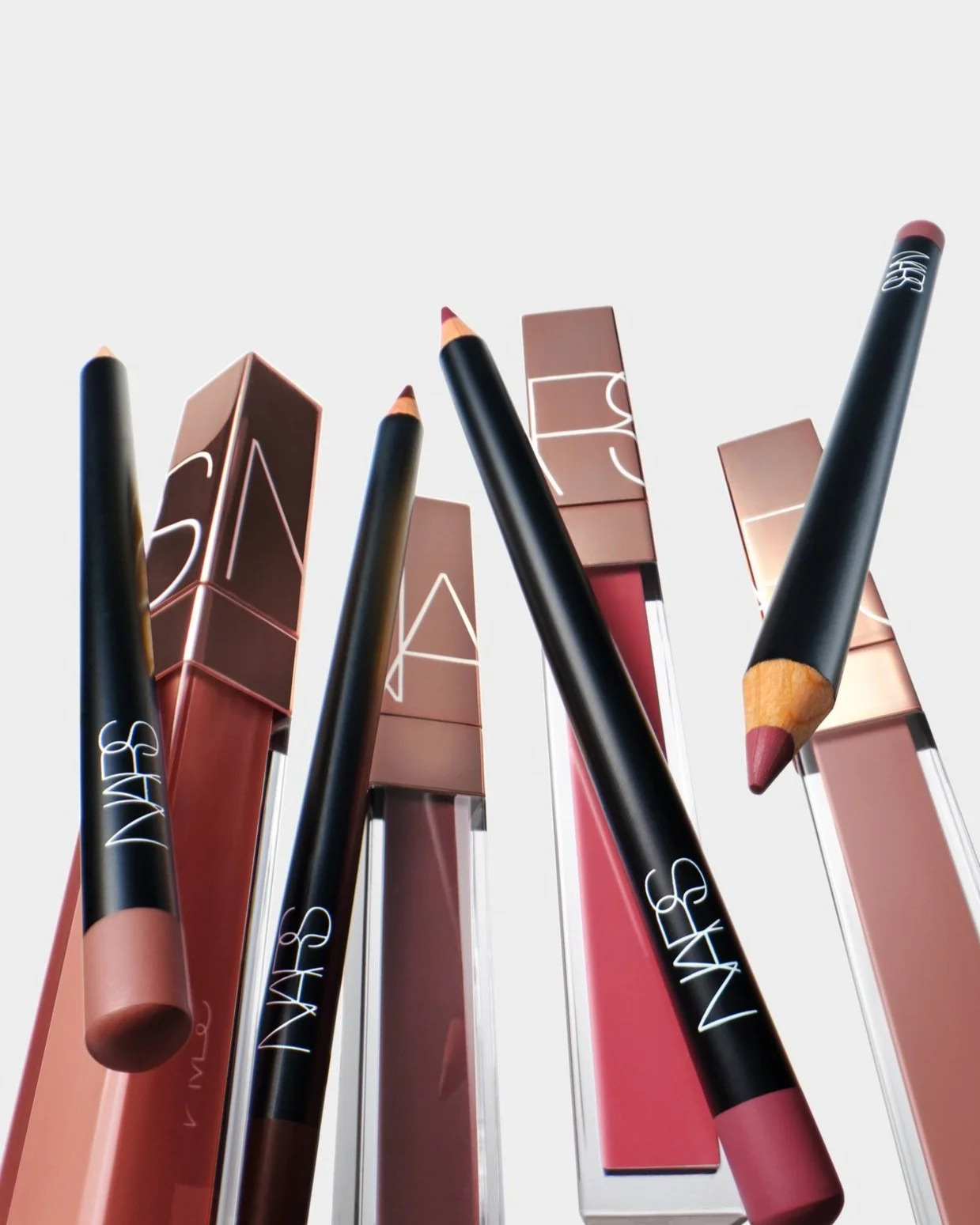 NARS_SU25_TheLipEdit_DigitalFirst_ProductStill_Shot8_AfterglowLipShine_ PrecisionLipLiner_HalongBay_ChelseaGirls_Marnie_Nympho_Spunk_SmoothTalk_CapD'Ail_GetHappy_GLBL.jpg