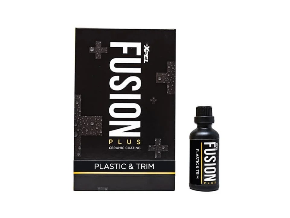 A black box and a bottle of Fusion Plus ceramic coating for plastic and trim, used for car detailing.