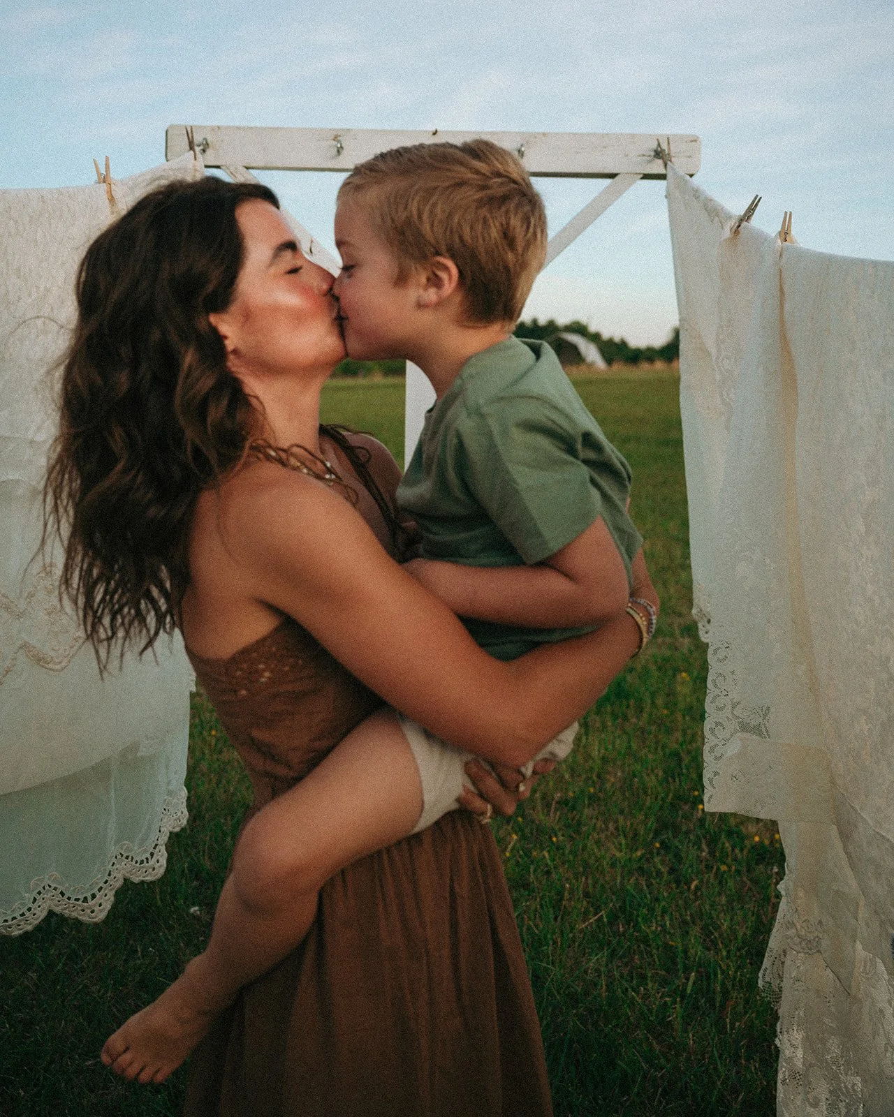 mom holding son during family session
