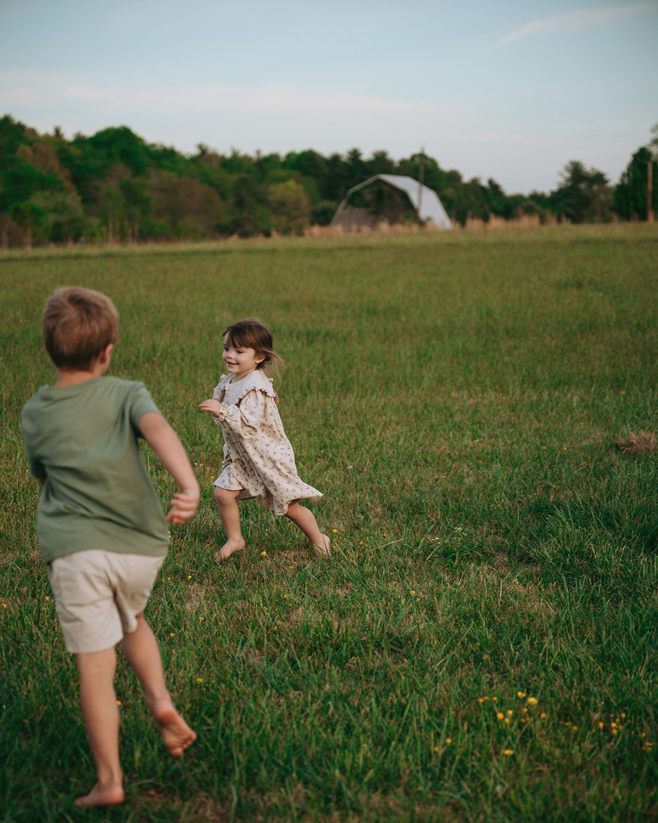 Kids running in a field during family session