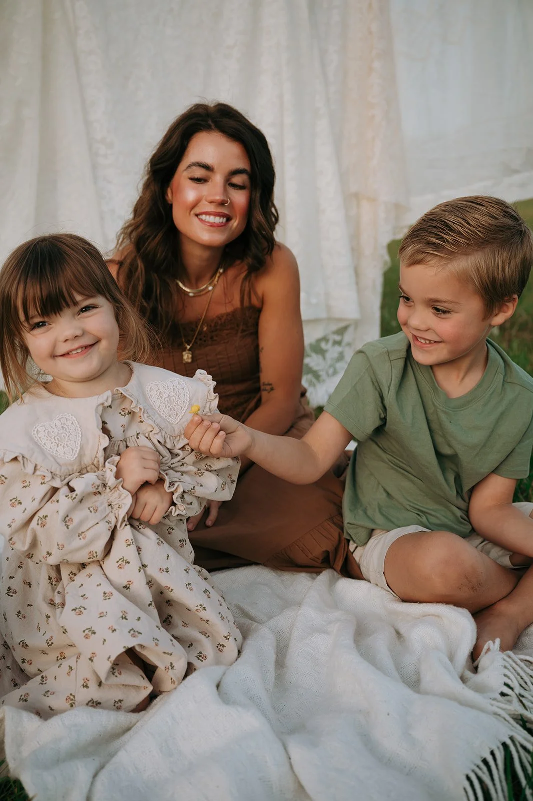 big brother giving sister a flow during family session