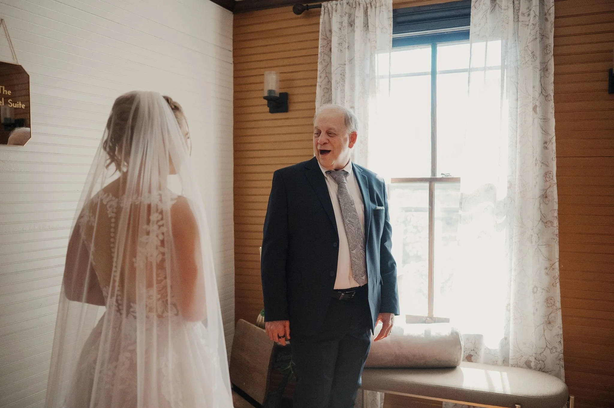 groom watching bride come down isle
