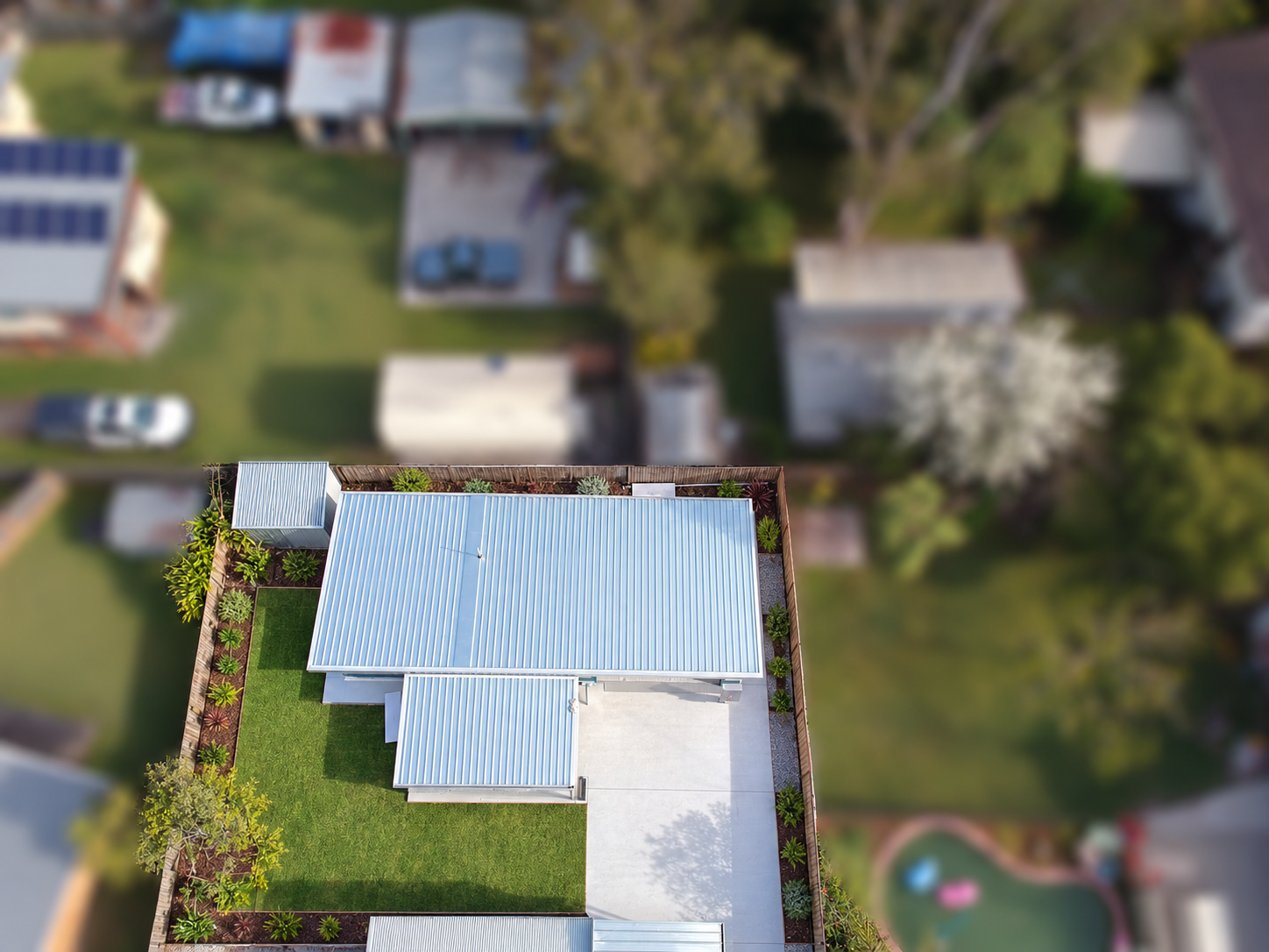 Granny flat landscaping concept — digitally edited landscaping; neighbouring properties blurred.
