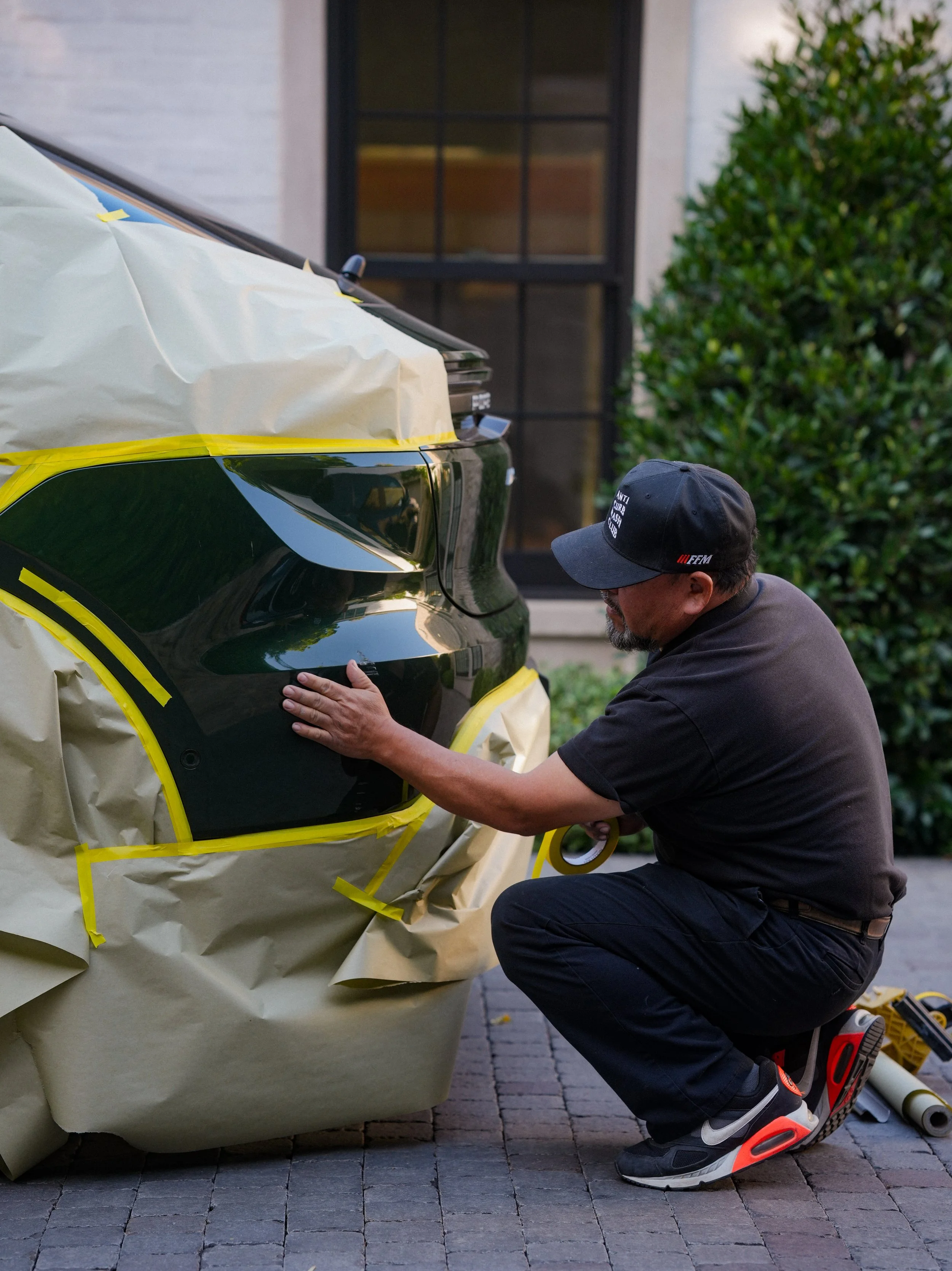 A bumper repair being done on a driveway in Orange County, CA.