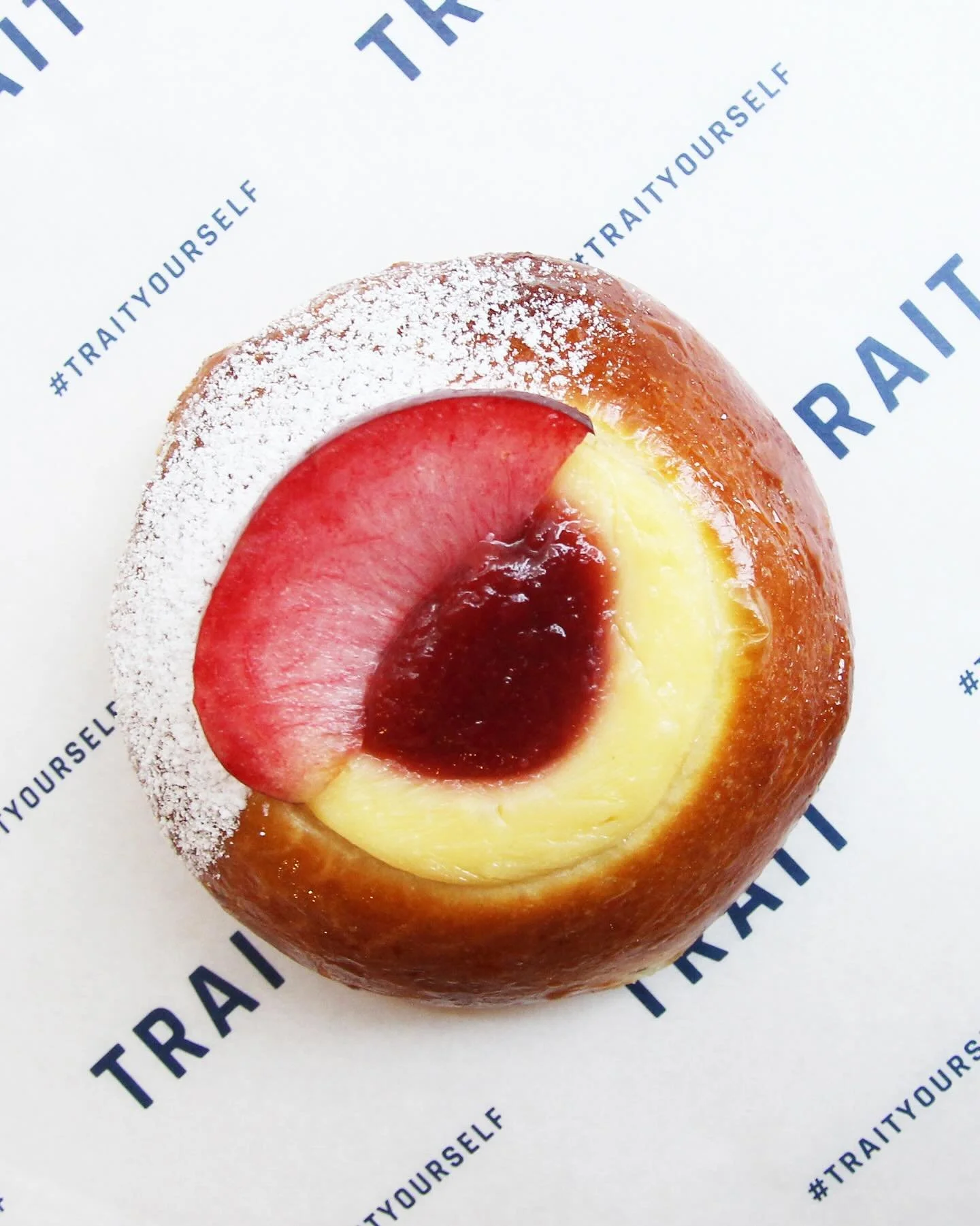 The perfect Sunday morning treat has arrived!

💜 Plum + Ginger Brioche 🫚

Our fluffy brioche bun has been filled with a sweet, creamy custard and plum jam, then topped with a slice of fresh plum and brushed with a sticky ginger syrup

Available acr