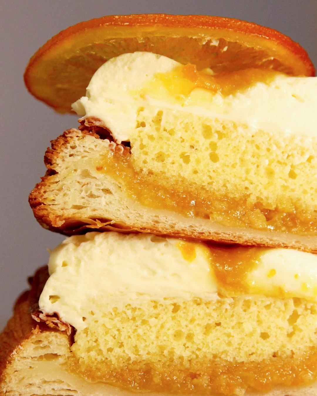 Have you had the chance to try our candied orange danish yet? 🍊🧡

Laminated croissant dough, filled with a light orange sponge cake &amp; orange compote. Topped with a vanilla ganache &amp; a candied orange slice 😍

#orangepastry #artisianbakery #