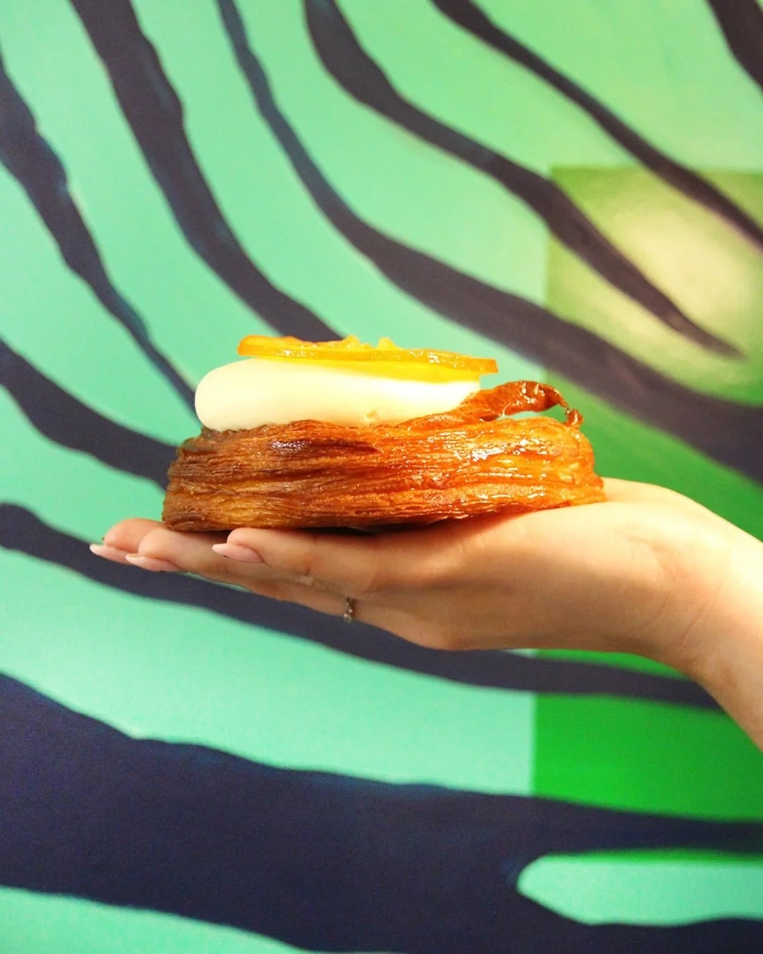 Flaky pastry, creamy vanilla &amp; candied orange 🍊

A citrus twist on a classic danish - laminated croissant dough, filled with a light orange sponge cake &amp; orange compote. Topped with a sweet vanilla ganache &amp; candied orange slice 

The pe