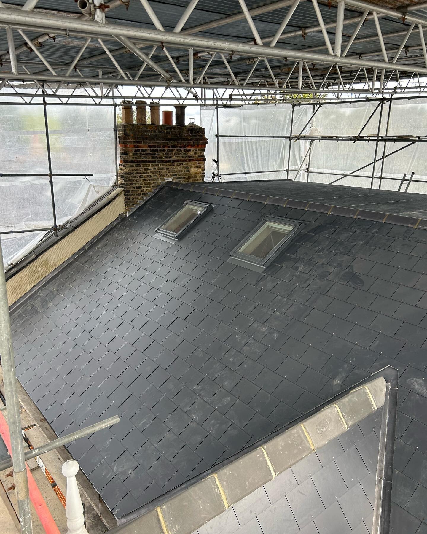 A Reroof in eltham we have just completed with new marley eternit slate and 3 layer felt system to flat roof on dormer Visit www.sapsford.co