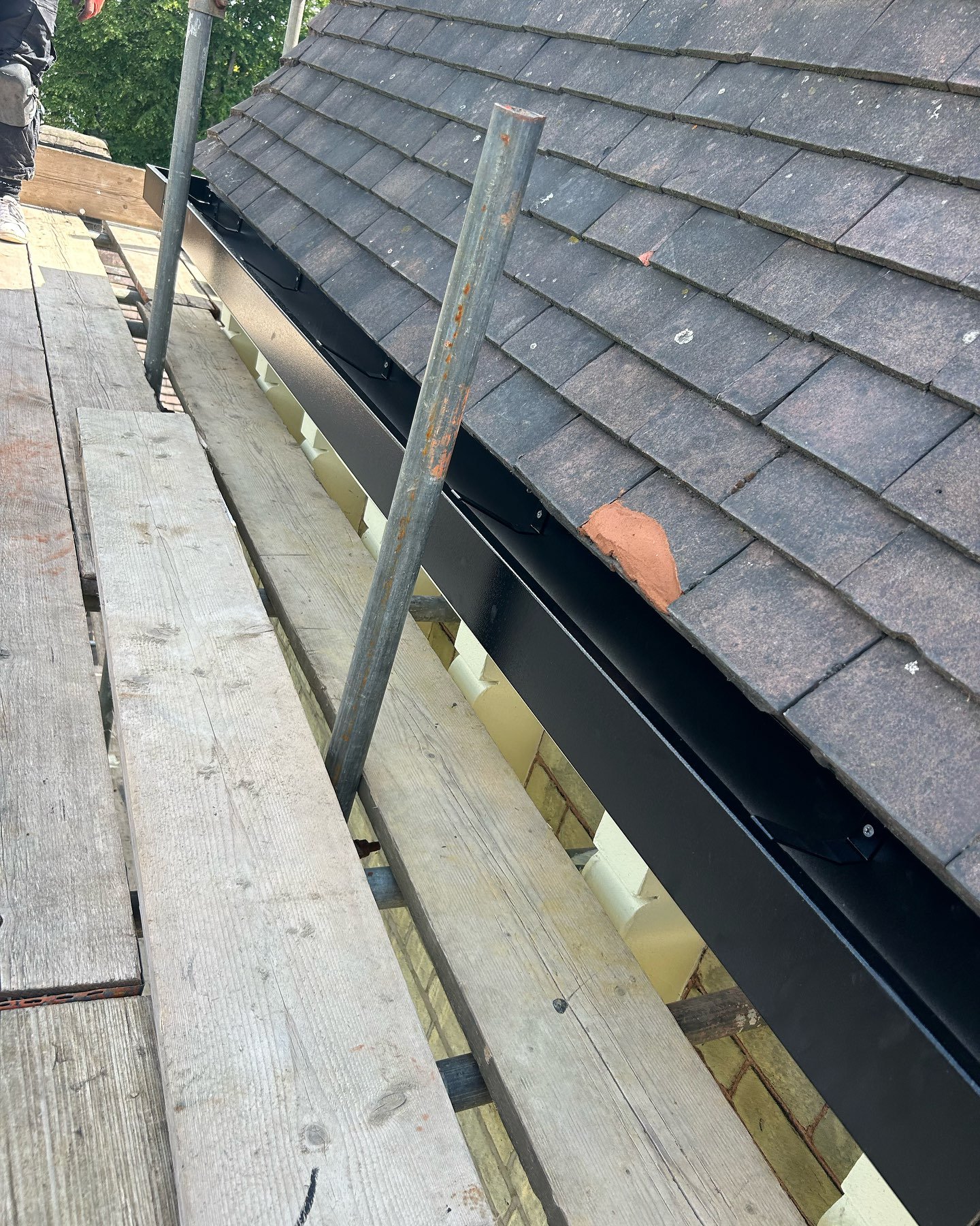New black aluminium square line gutter system we installed today on a turret at our Sydenham site. Visit www.sapsford.Co