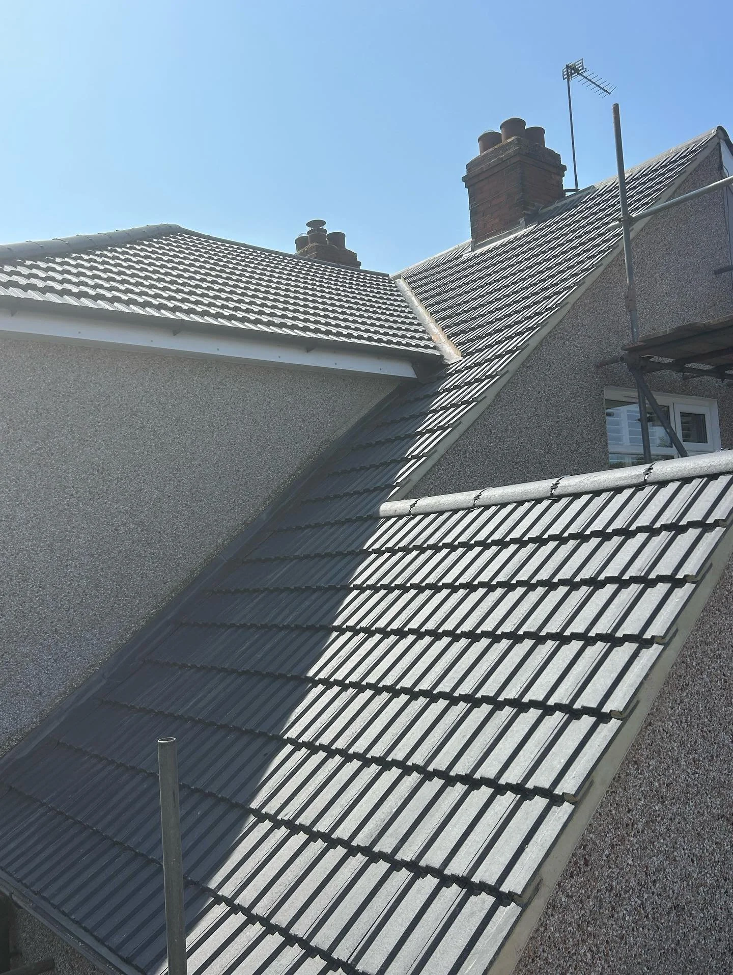 A Re roof we completed couple weeks back in welling  with marley ludlow interlocking tiles grey and Marley plain tiles in grey on front window bay roof and Vertical tiling to front apex to match main roof tiles visit www.sapsford.Co