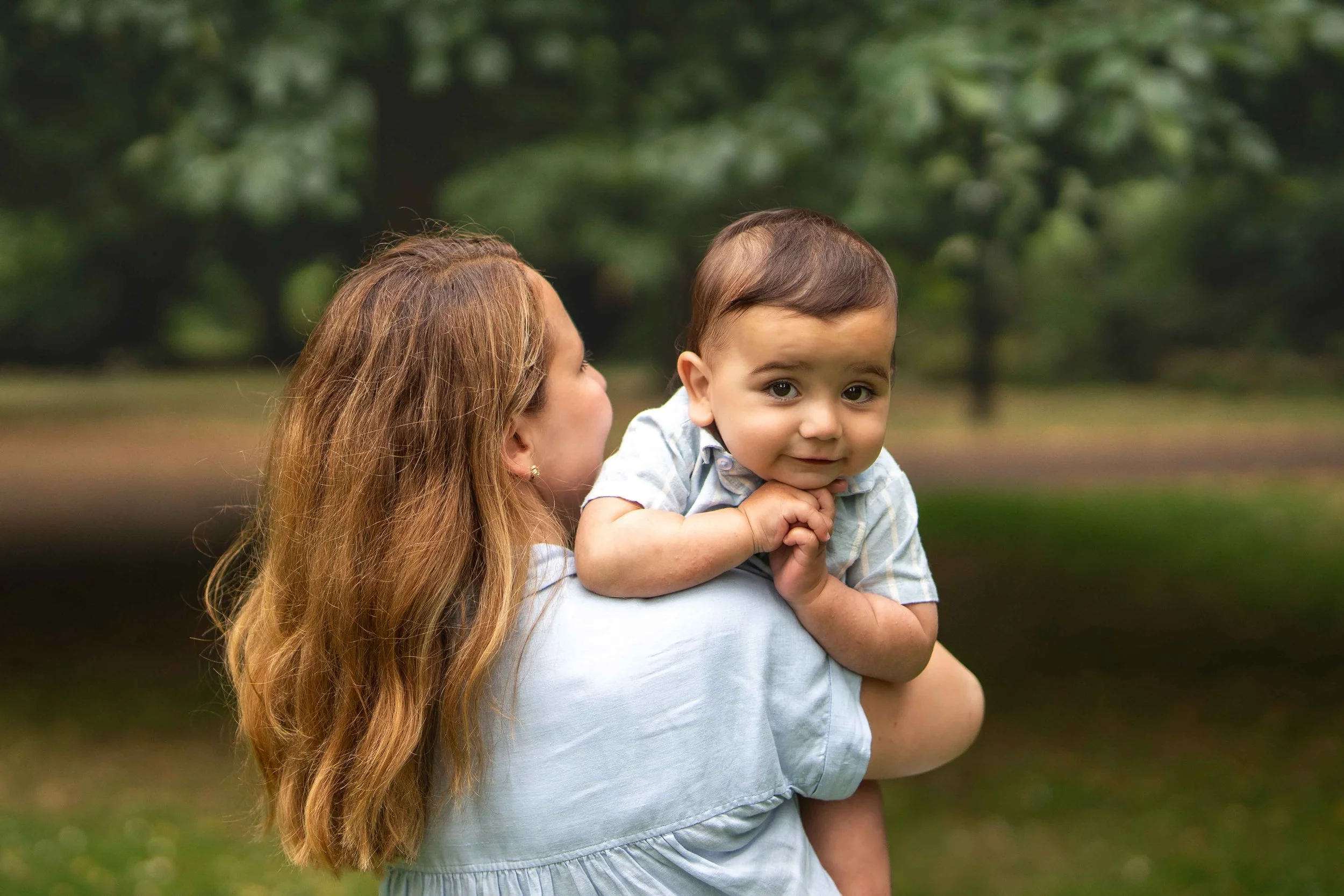 cute cuddles with mummy in a park in Southampton