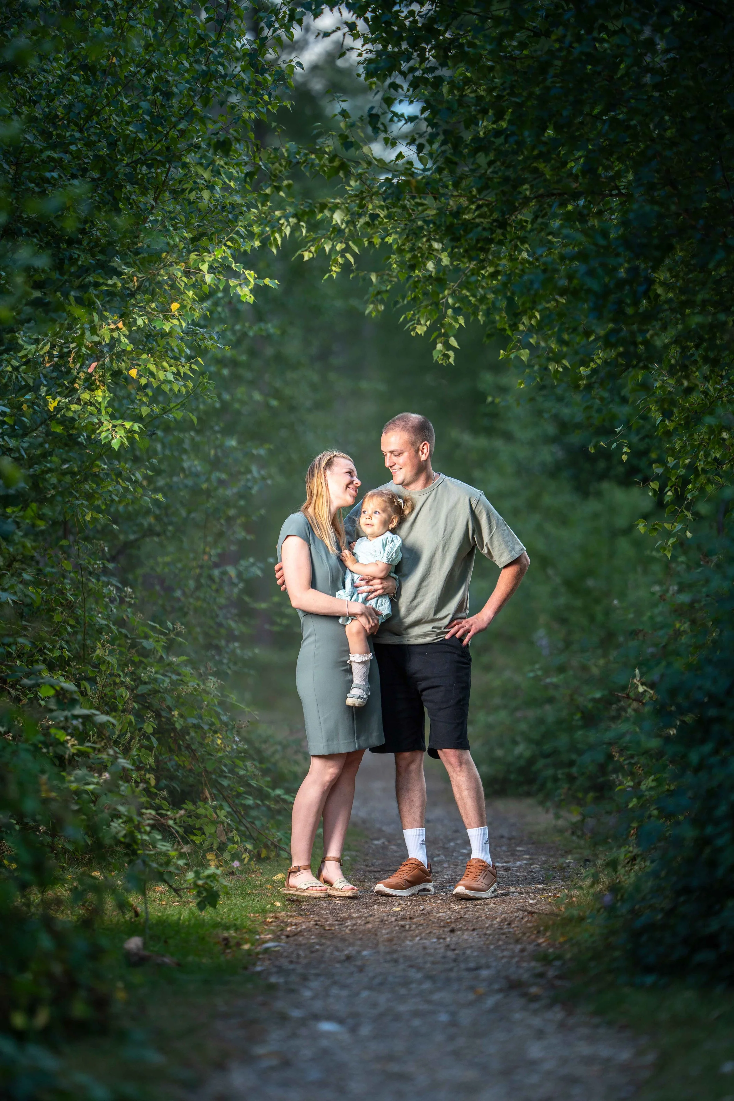 Family portrait using off-camera flash in the forest