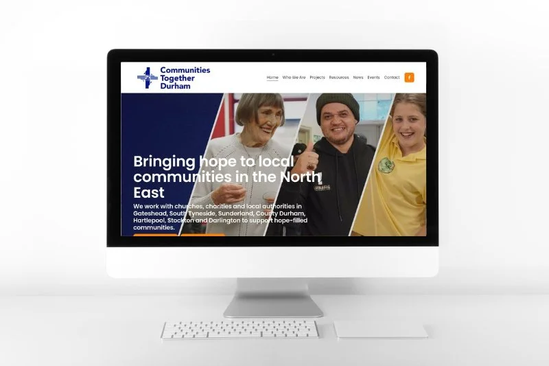 Screenshot of the Communities Together Durham website on an iMac computer, displaying the homepage with the slogan 'Bringing hope to local communities in the North East' and images of diverse community members.