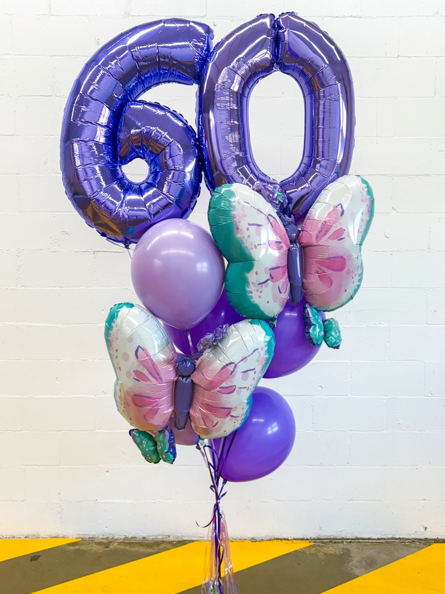 Milestone birthdays call for over the top helium balloon bundles 💜🦋