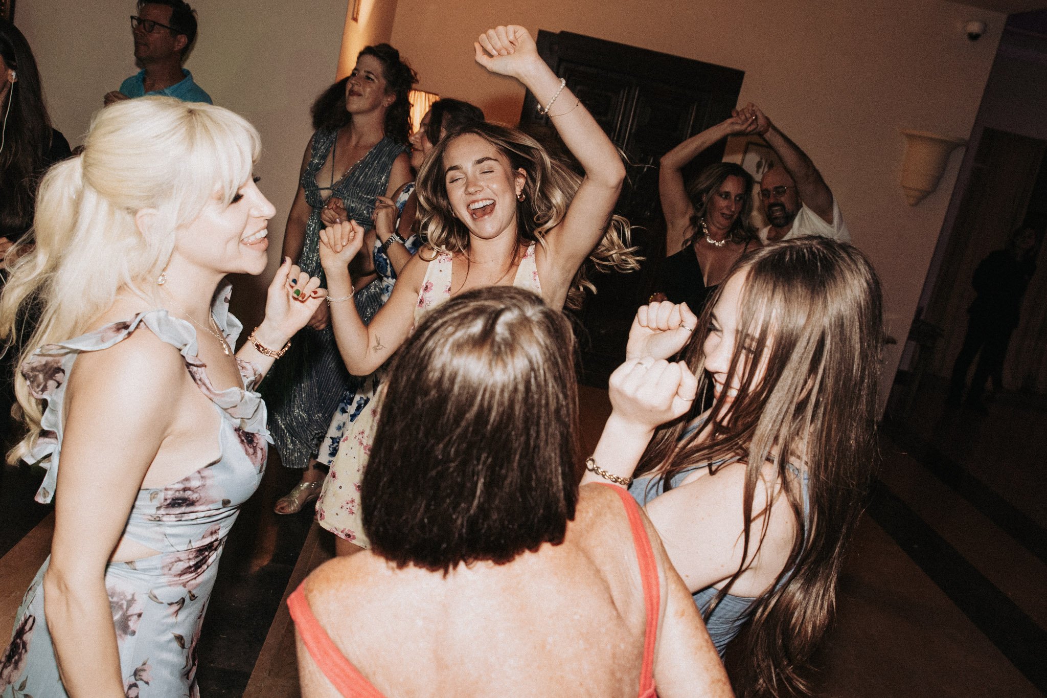 fun-portrait-of-wedding-guests-dancing-at-party-xamandreu-valencia-destination-wedding-photographer.jpg