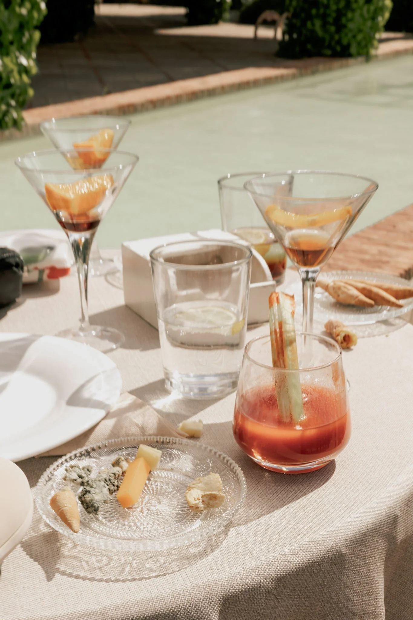 casual-table-with-drinks-and-cheese-detail-jardines-de-alfabia-mallorca-destination-wedding-photographer.jpg