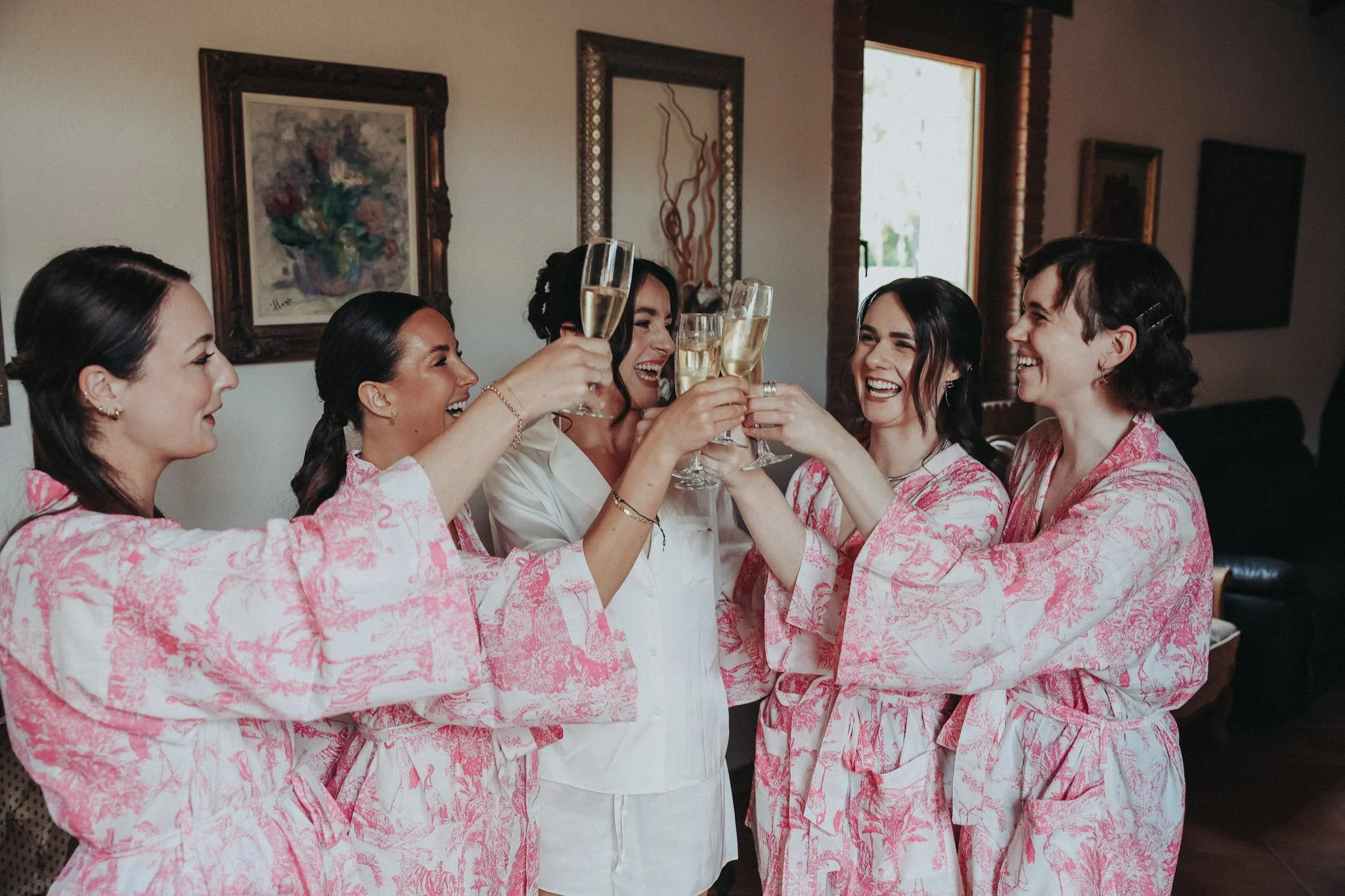 bride-and-bridesmaids-toasting-portrait-in-film-35mm-hotel-santa-marta-girona-destination-wedding-photographer.jpg