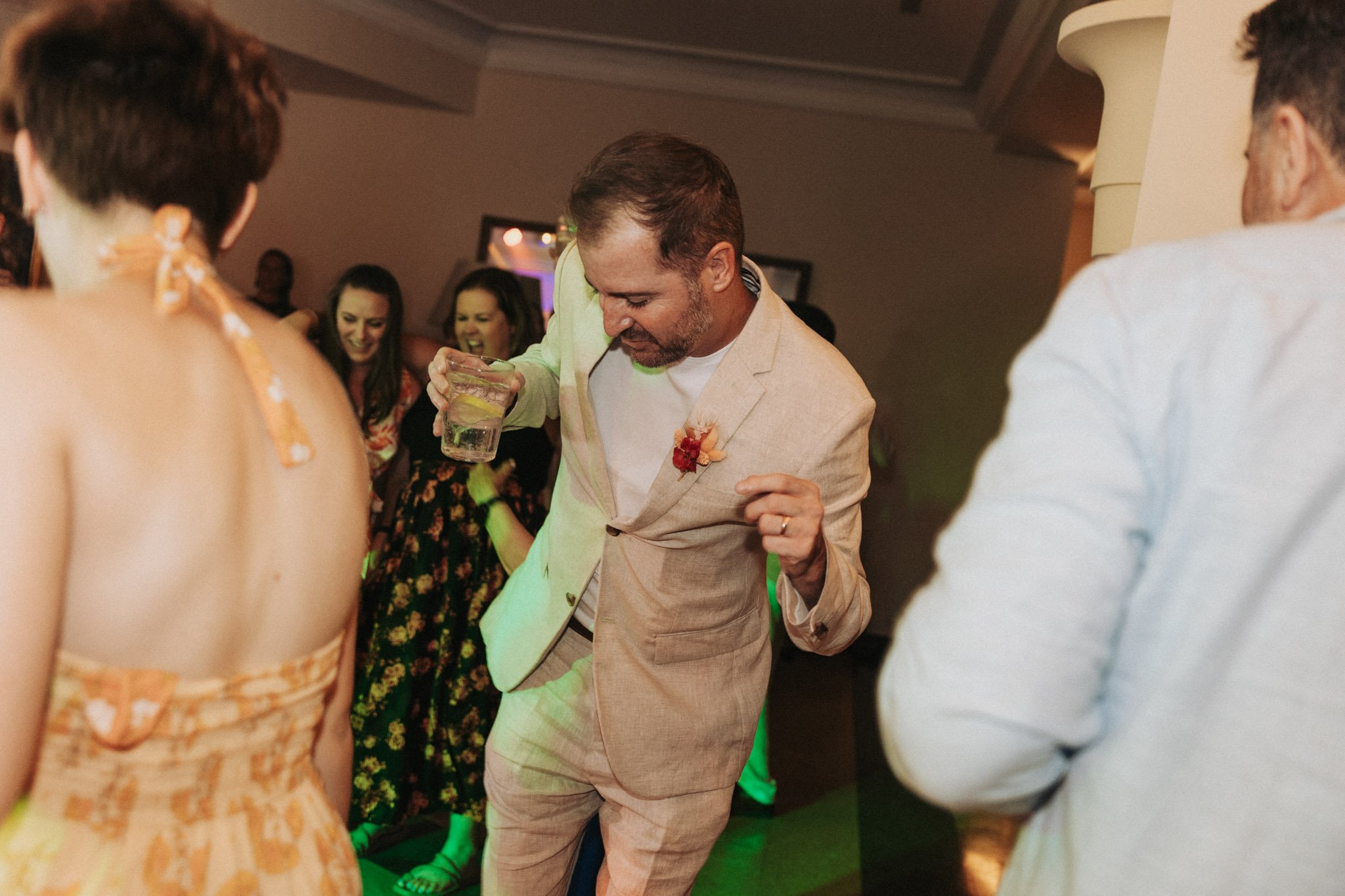 portrait-of-wedding-celebrant-dancing-at-party-costa-brava-la-gavina-girona-destination-wedding-photographer.jpg