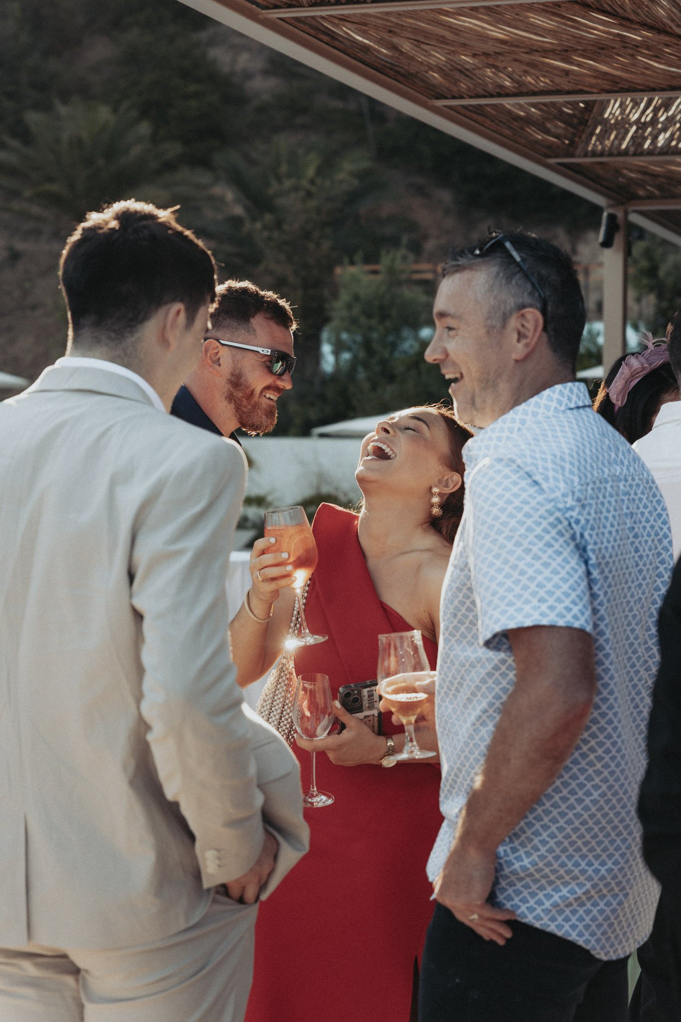 candid-portrait-of-wedding-guests-having-fun-during-cocktail-time-mas-torroella-girona-destination-wedding-photographer.jpg