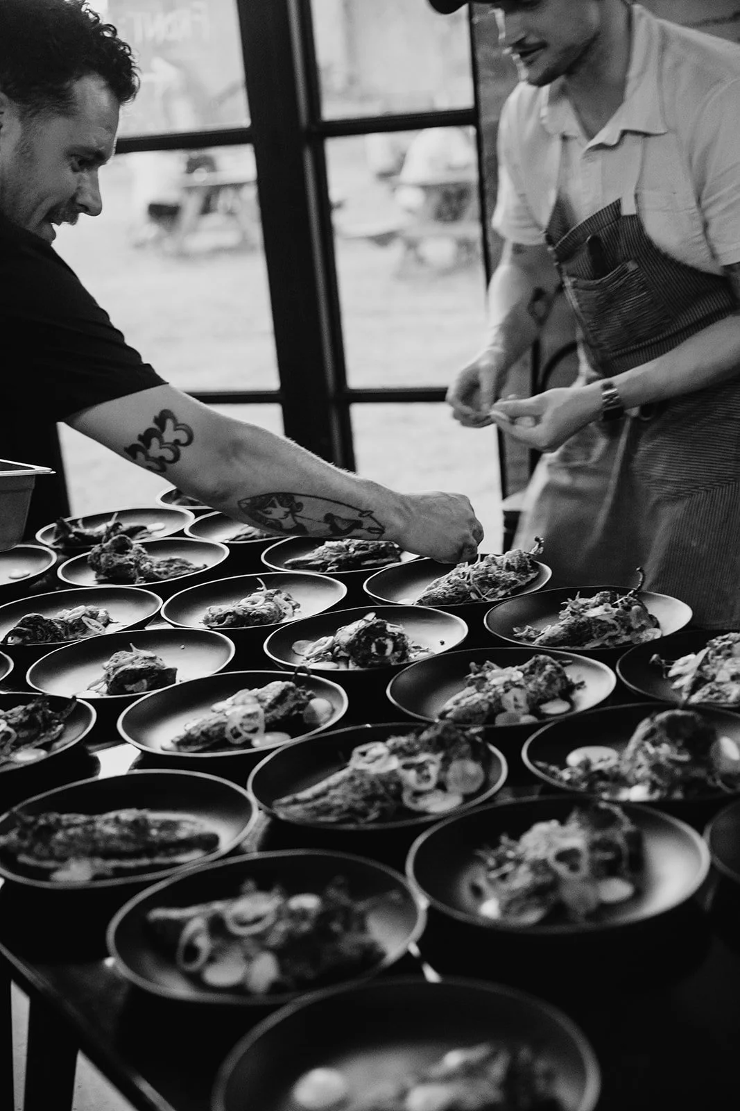 Gold Epicure chefs plating dishes for a large catered event