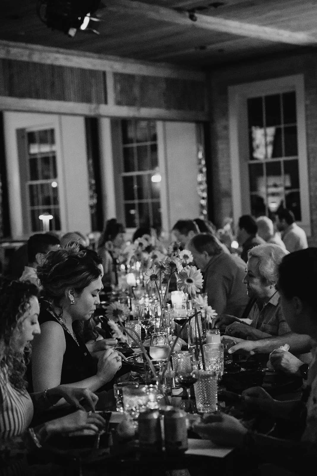 Guests gathered around a candlelit private dinner catered by Gold Epicure