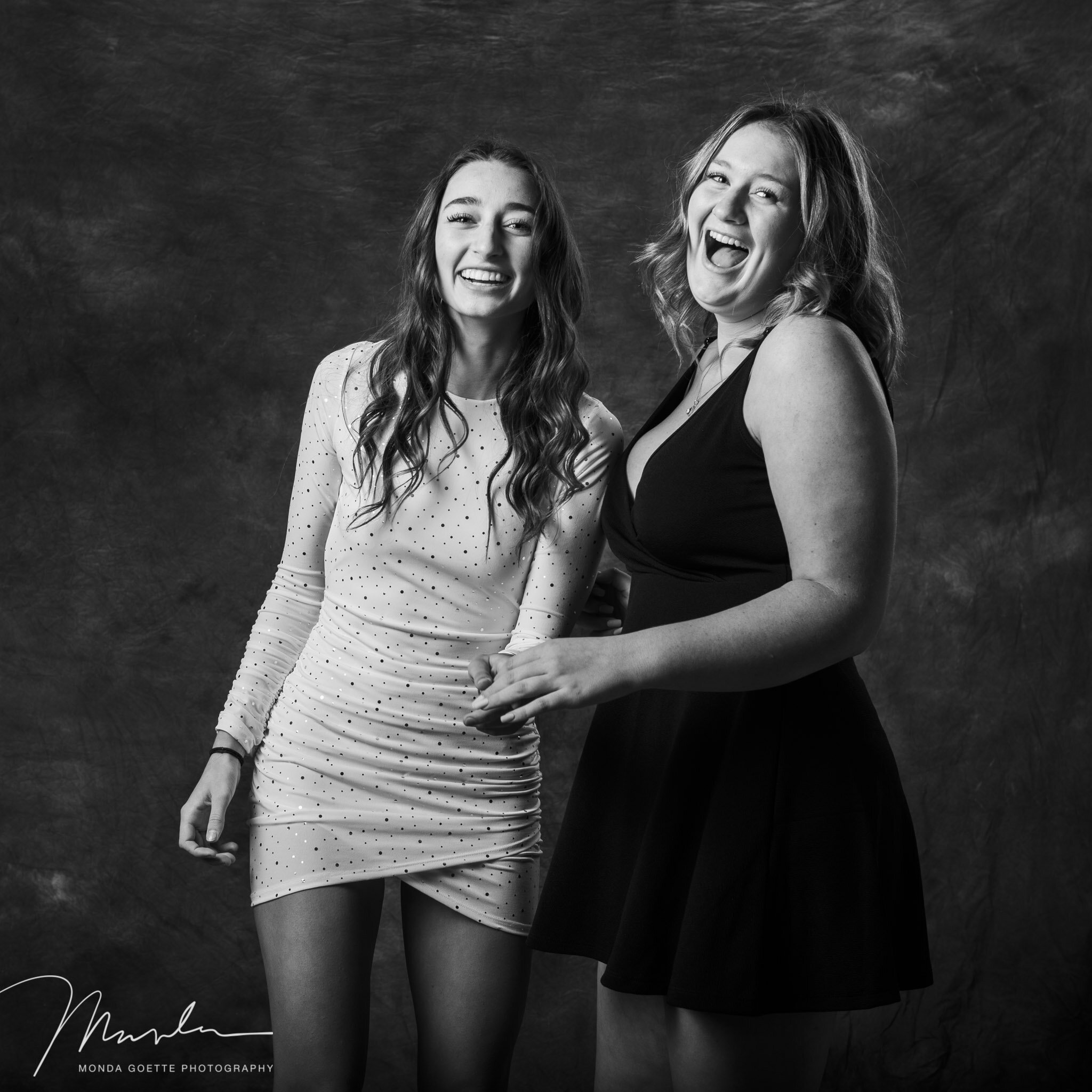 Two girls laughing during photo session at Mondafoto in St Paul, MN