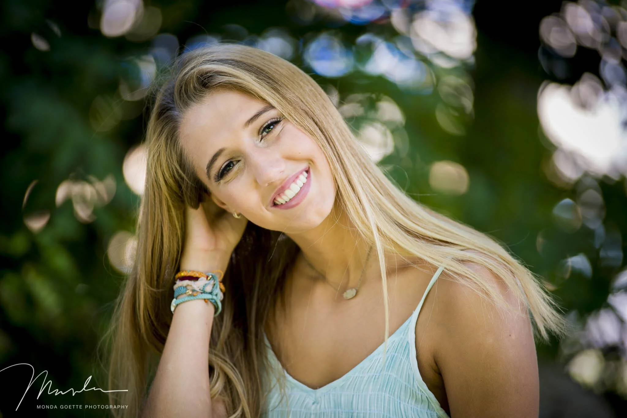 Close  up of a smiling girl for her senior photos in St. Paul, MN.