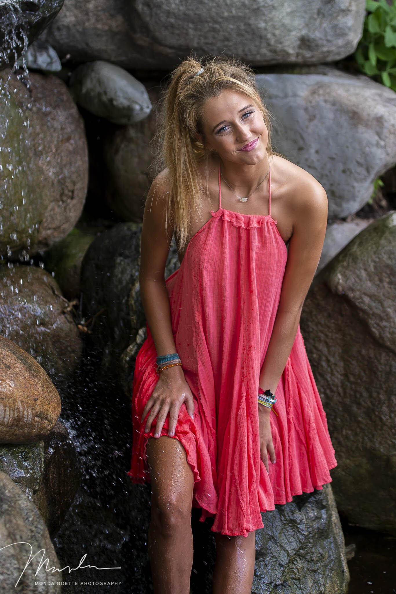 Waterfall portrait of high school senior during photo session in Minnesota.