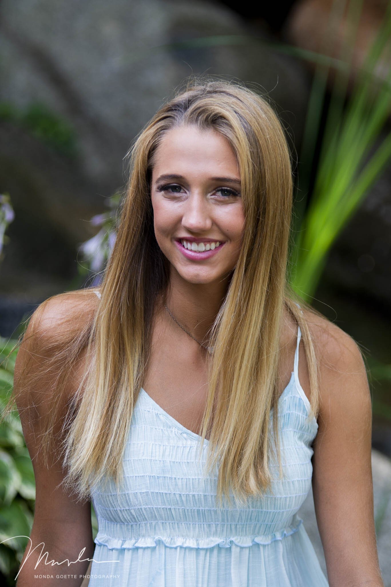 Girl wearing aqua dress for her senior session with Monda Goette Photography.