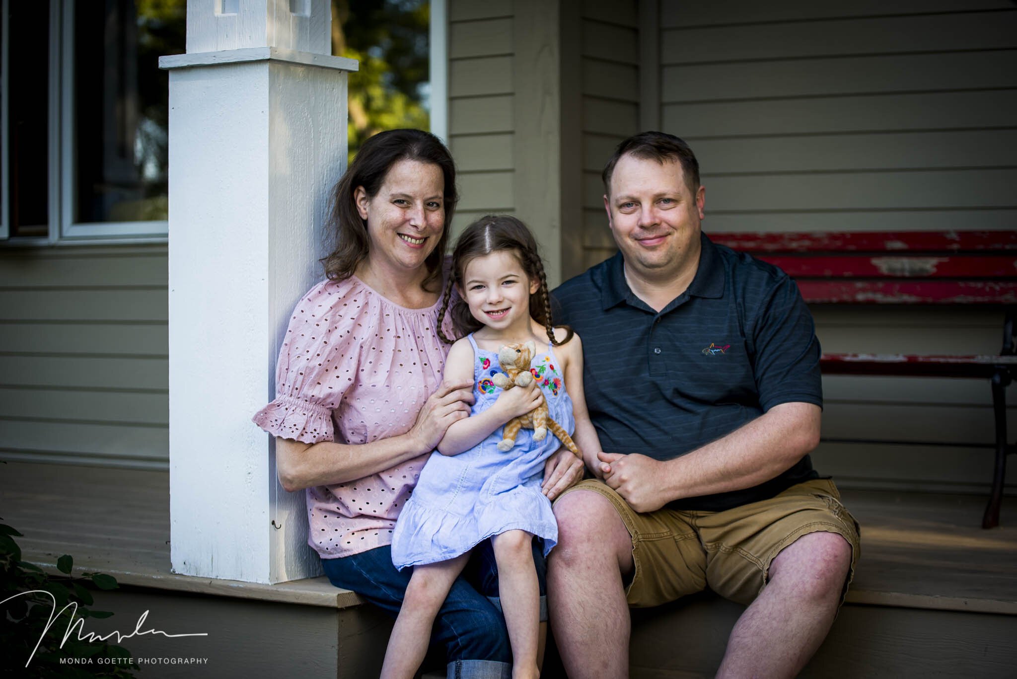 Family of three on porch for Minnesota Family Photo Session.