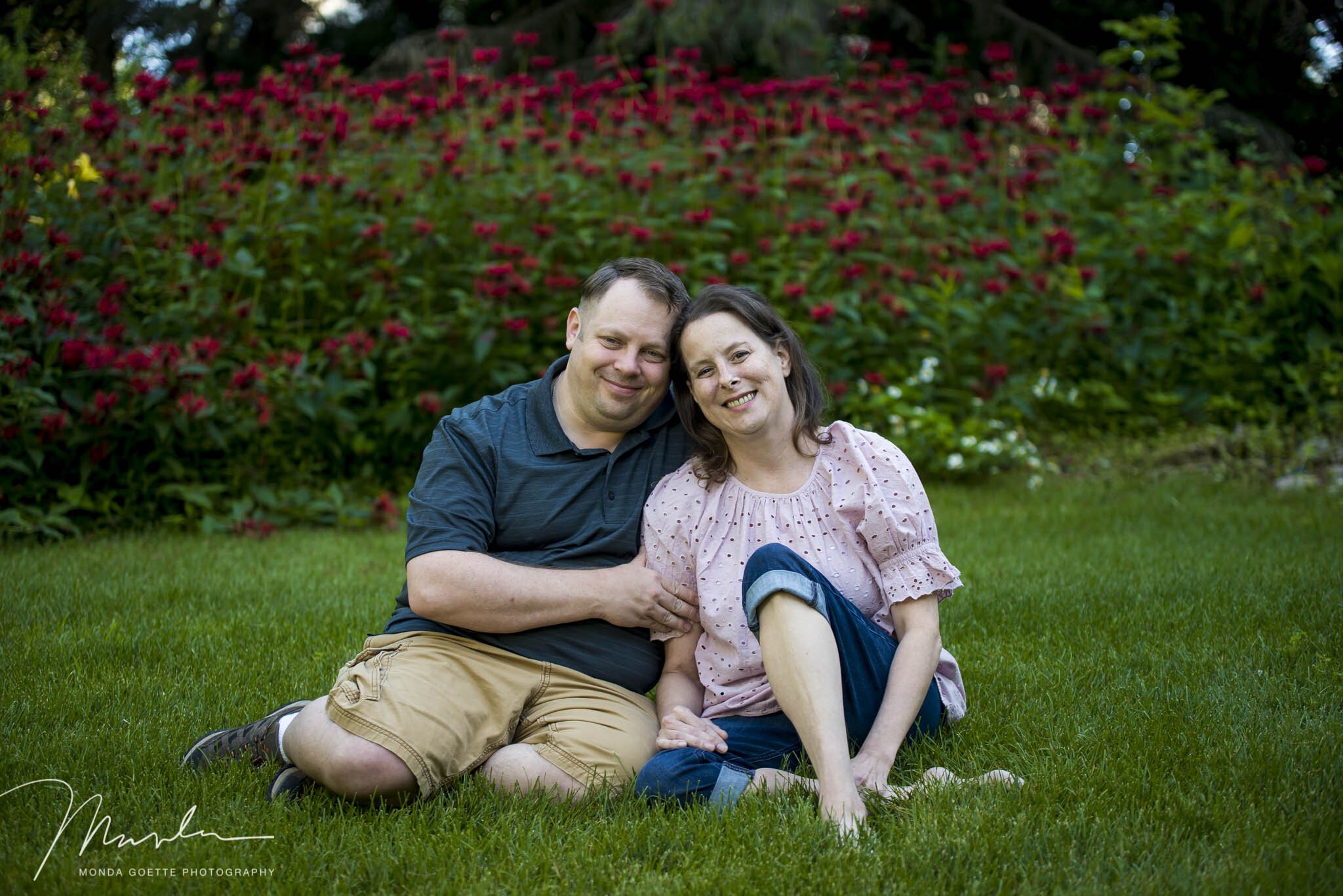 Husband and wife posing for family photo in MN.