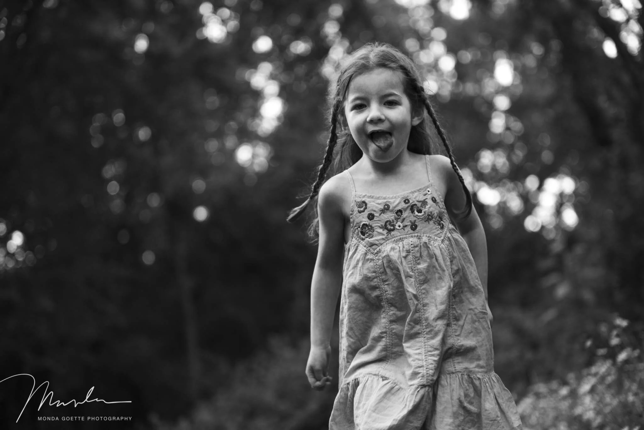 Young girl running carefree in the grass in Woodbury, MN.