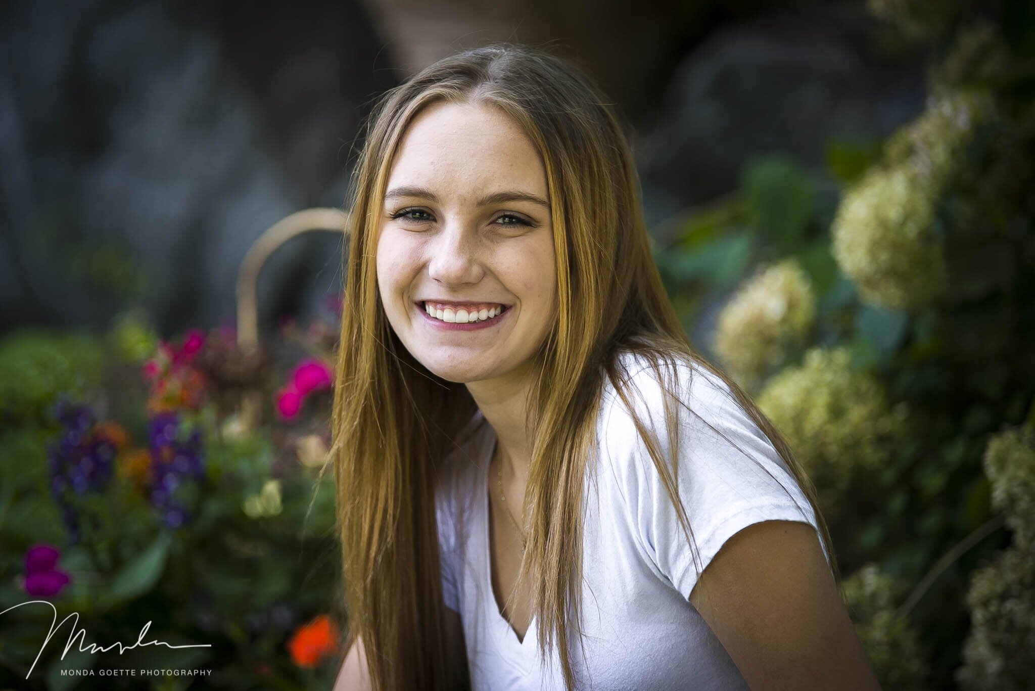 High School Senior Girl sitting in rocks for Minnesota photo session with Monda Goette Photography