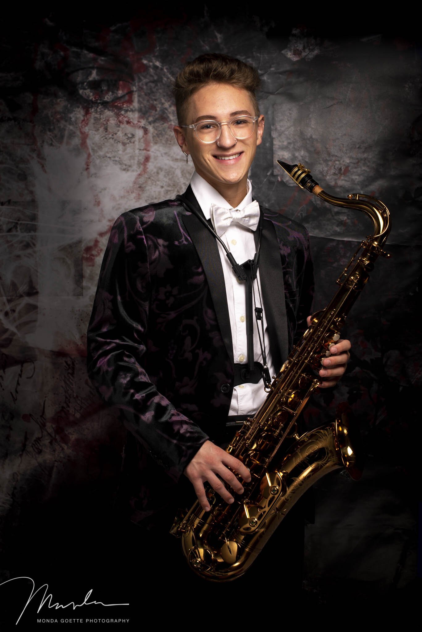 high school senior guy with his saxophone for photo session in twin cities