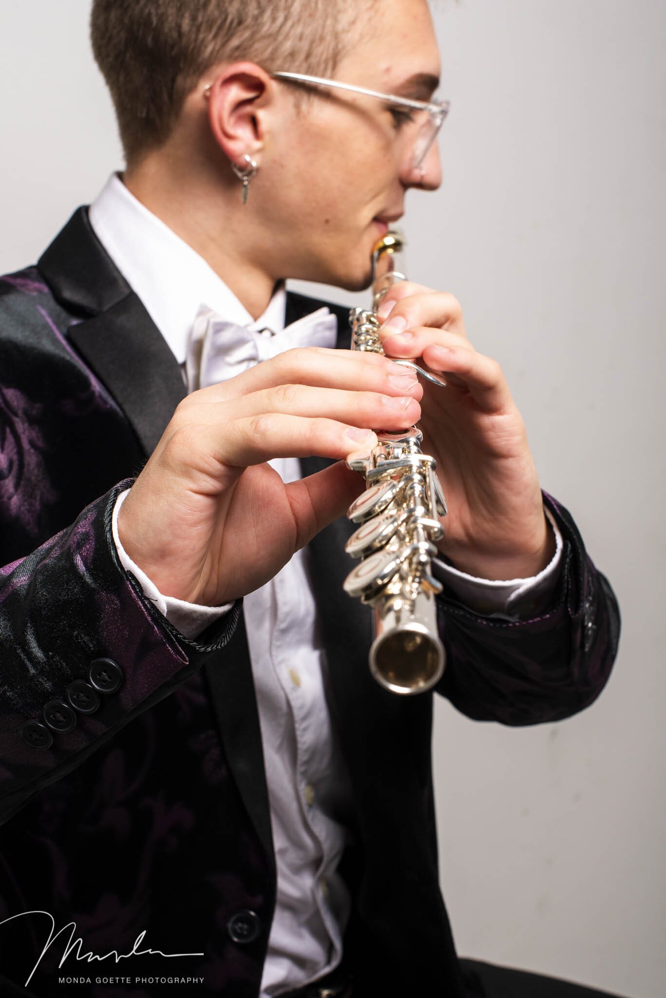 Twin Cities high school senior guy playing his flute for photo session