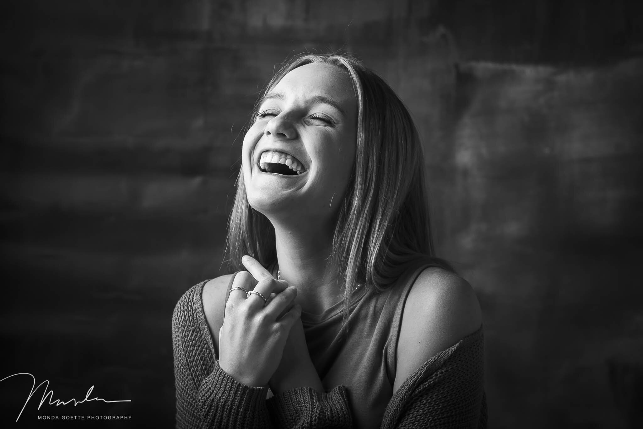 senior photos of a girl in MN smiling in black and white