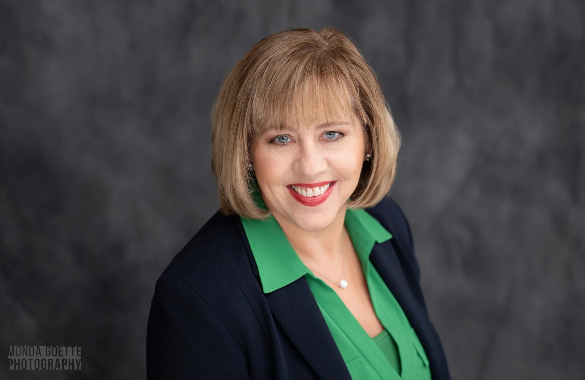 Female professional business posing for a headshot portrait with Monda Goette Photography