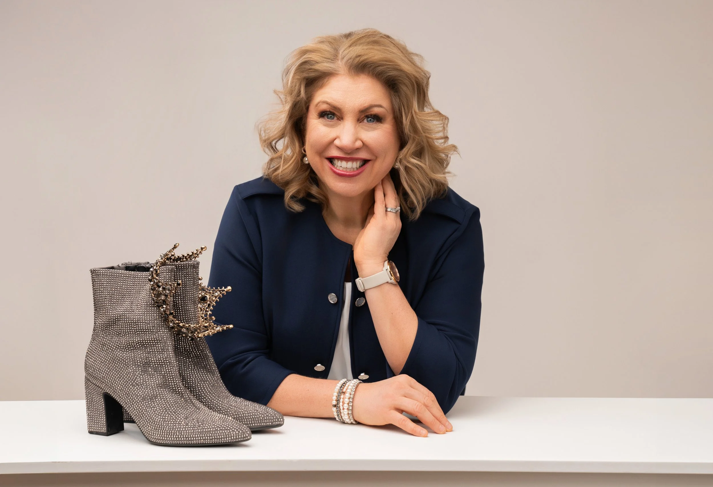 Princess Paula of Hudson Wisconsin posing with her crown, sparkle boots, and a smile