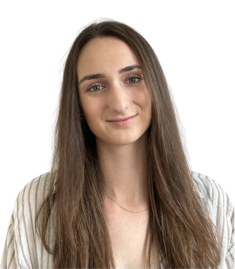 A young woman with long brown hair, light skin, and blue eyes, smiling gently, wearing a light-colored striped shirt, against a plain white background.