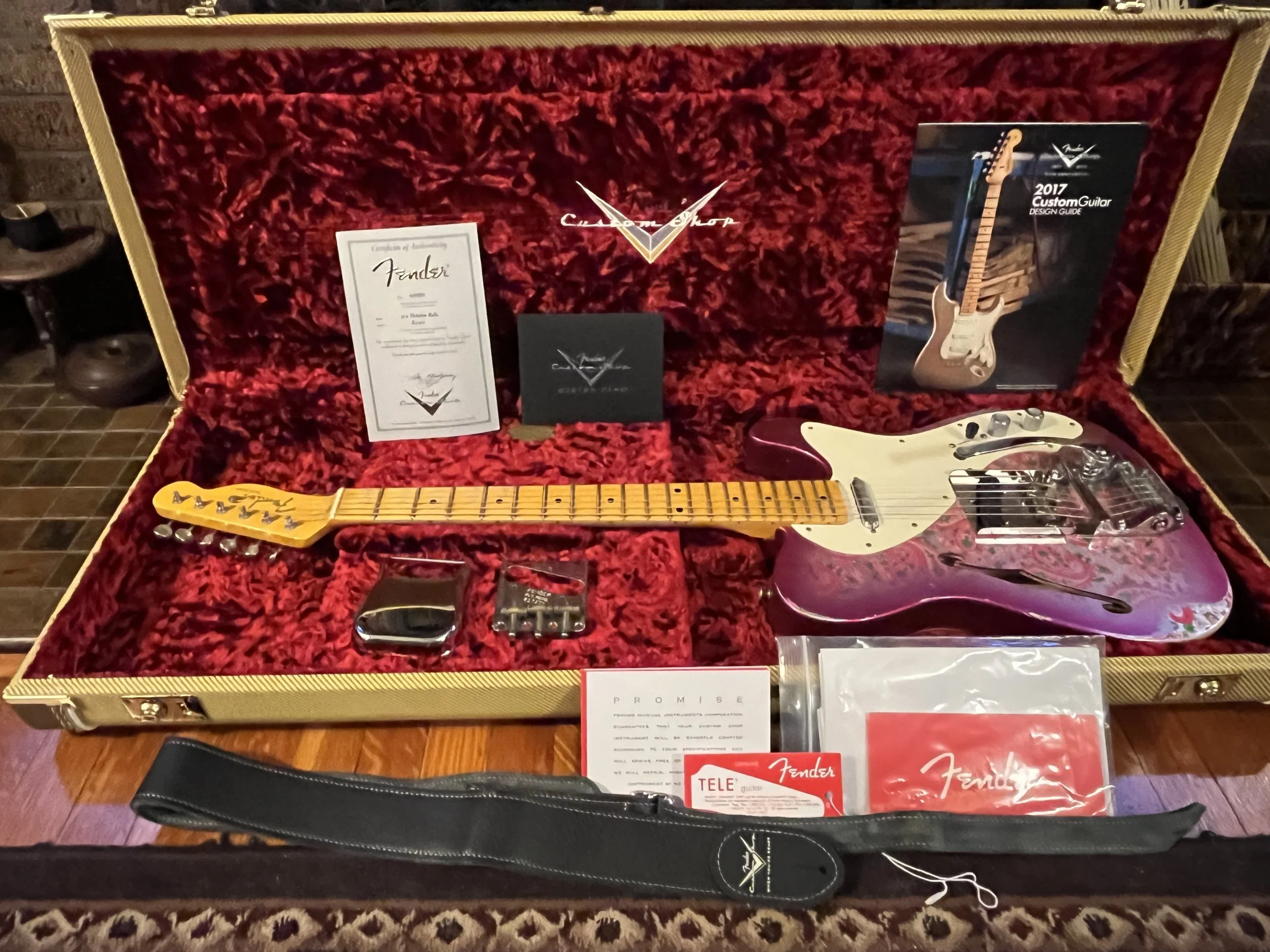 Reliced pink paisley Fender Telecaster Thinline 50s in its case with all it's accessories, attached Bigsby, and paperwork, including original tailpiece and branded strap.