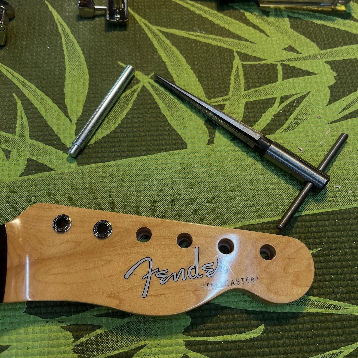 Fitting tuner bushings on a new Tele neck.