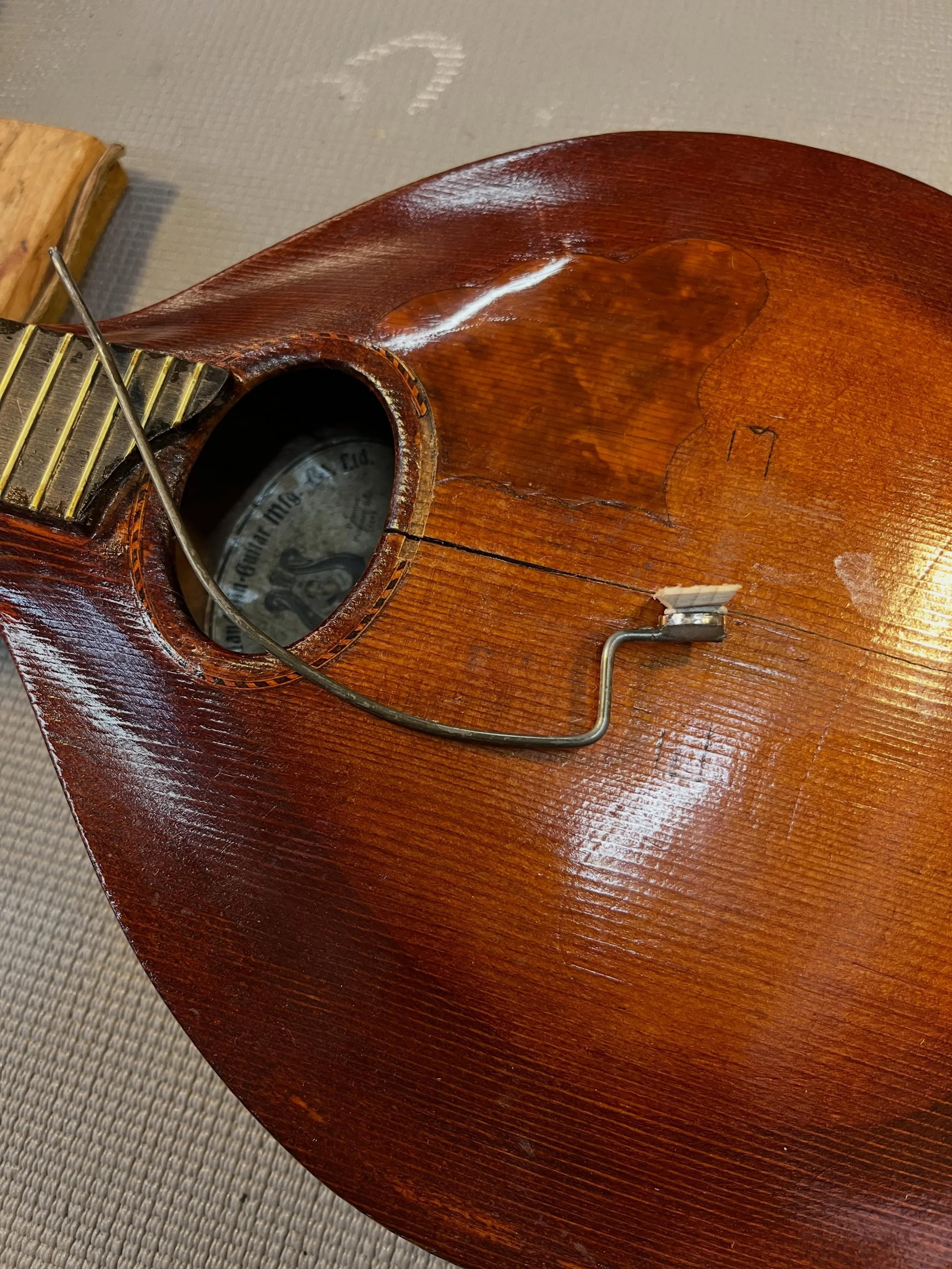One of the satisfying challenges as a luthier is fabricating specialized tools and jigs. I just made this magnetic cleat setter for accurate placement of cleats on the underside of the top to reinforce cracks.