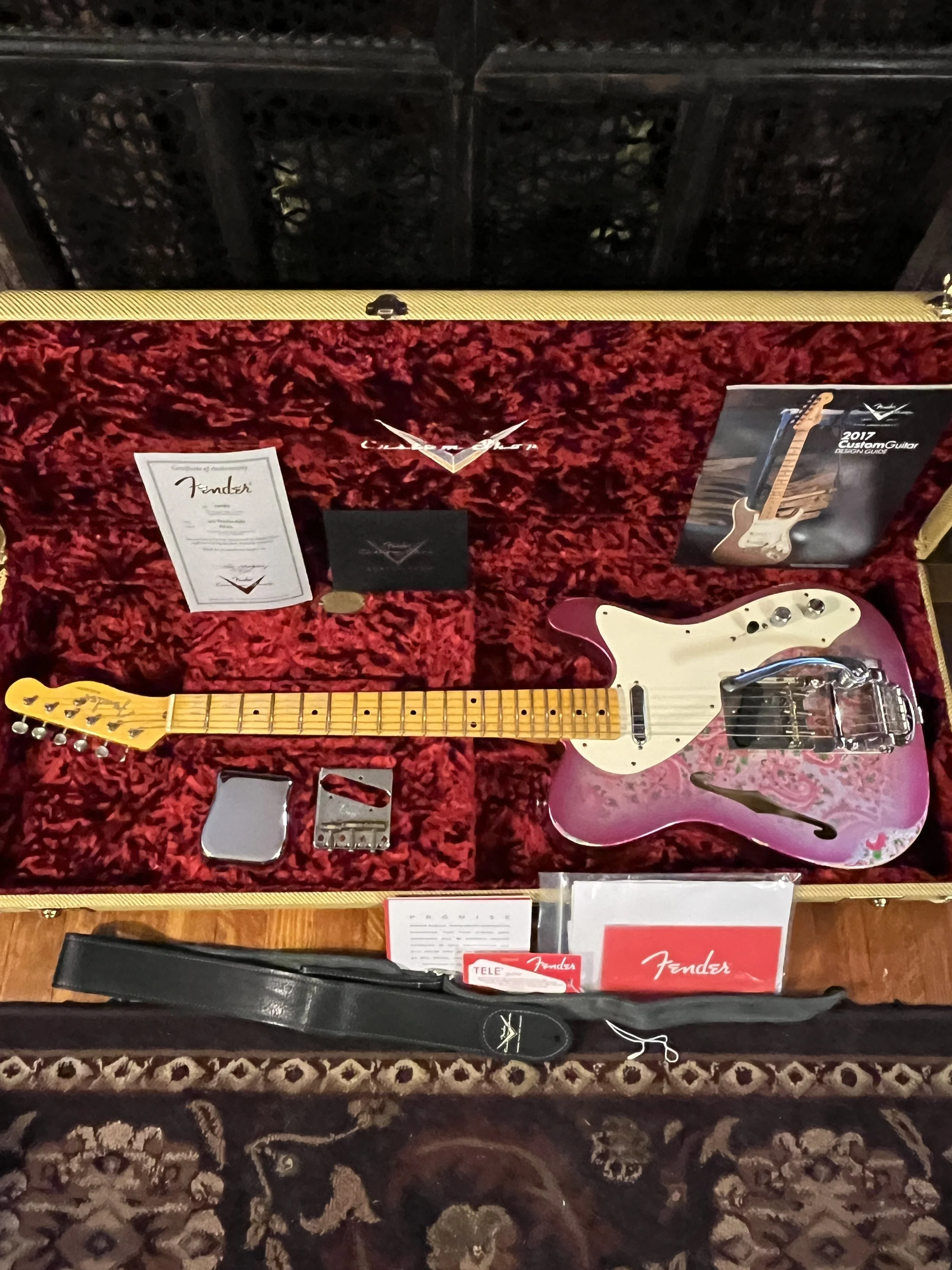 Reliced pink paisley Fender Telecaster Thinline 50s in its case with all it's accessories and paperwork, including original tailpiece and branded strap.