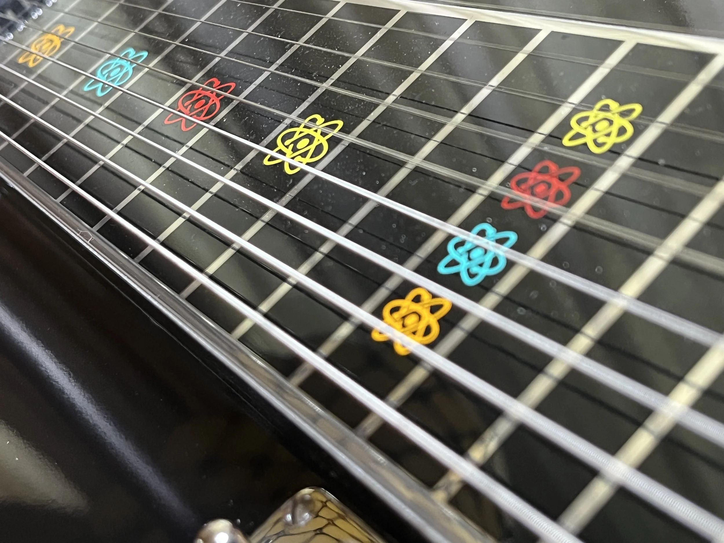 Emmons Resound'65 S10 Pedal Steel fret markers in retro atomic design in turquoise, red, yellow, and orange.