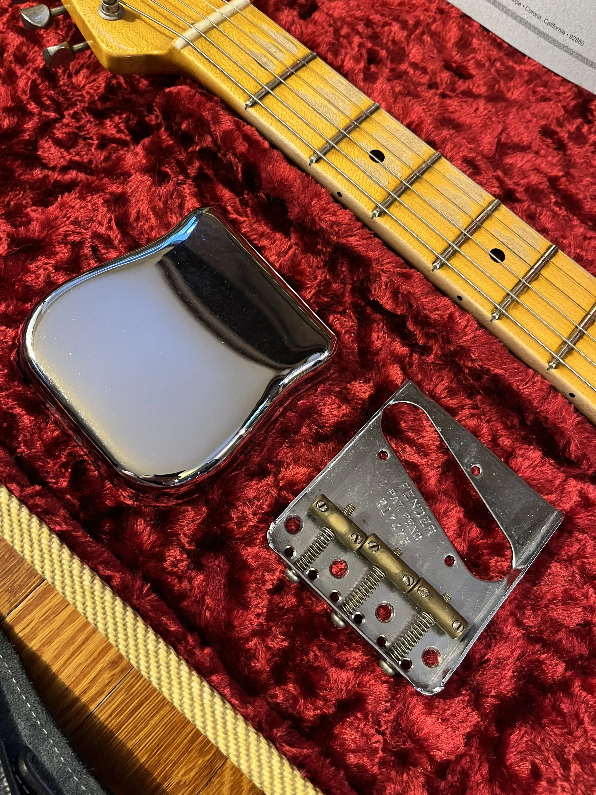 The original tailpiece for the reliced pink paisley Fender Telecaster Thinline 50s.