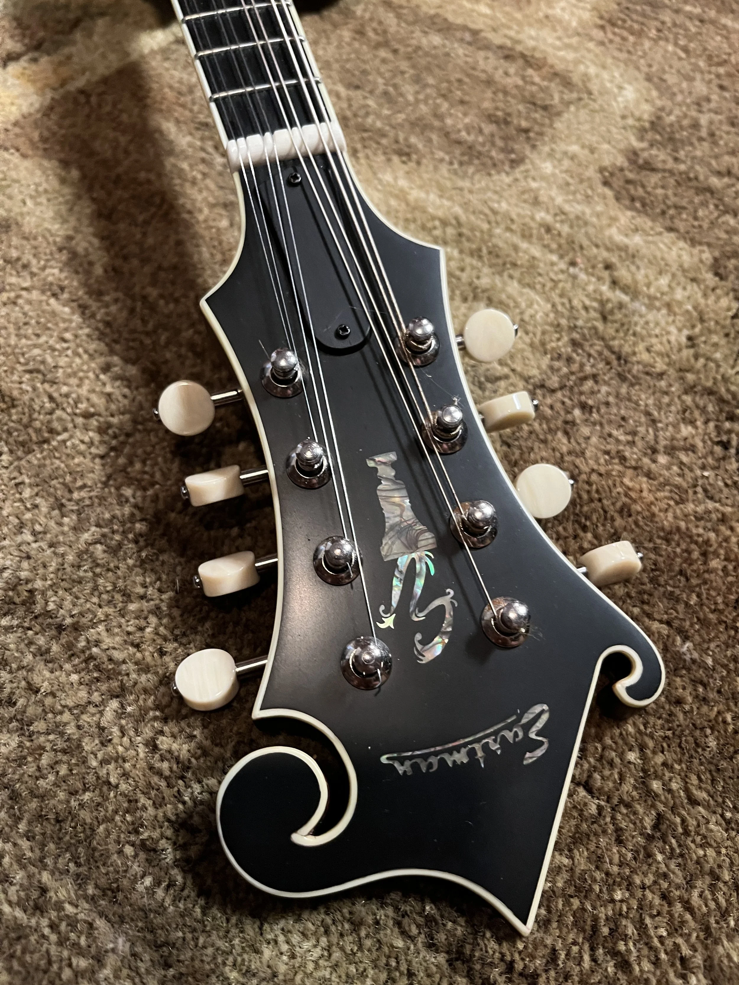 Eastman 715 Mandolin detail view of front of headstock, showing tuning pegs and nut. (2024, #6 of 15, original run)
