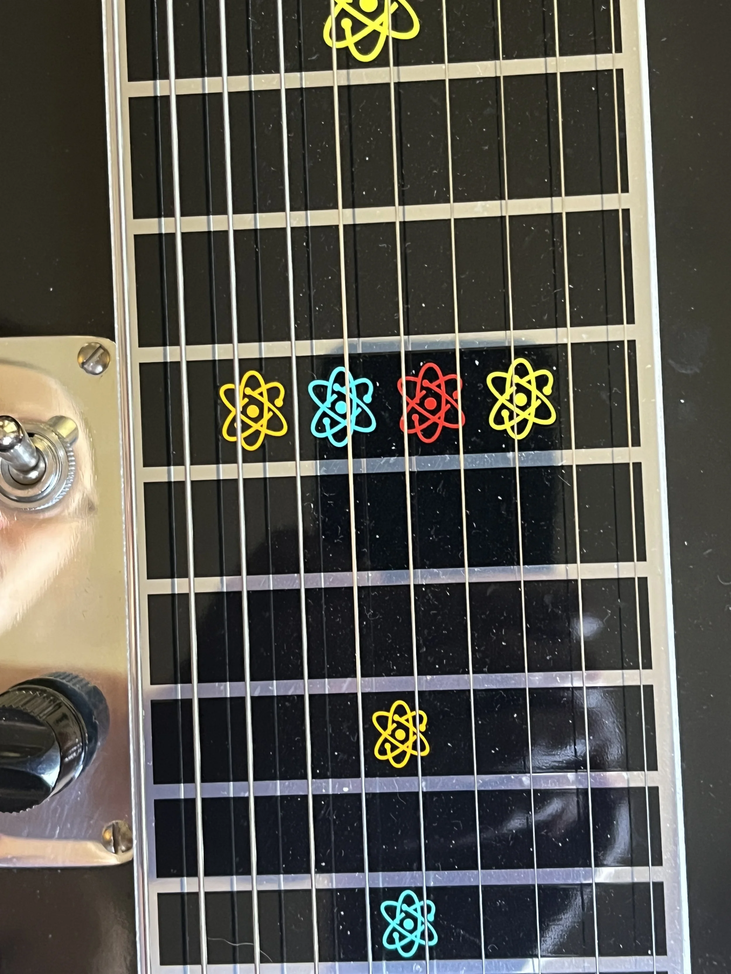 Emmons Resound'65 S10 Pedal Steel fret markers in retro atomic design in turquoise, red, yellow, and orange.