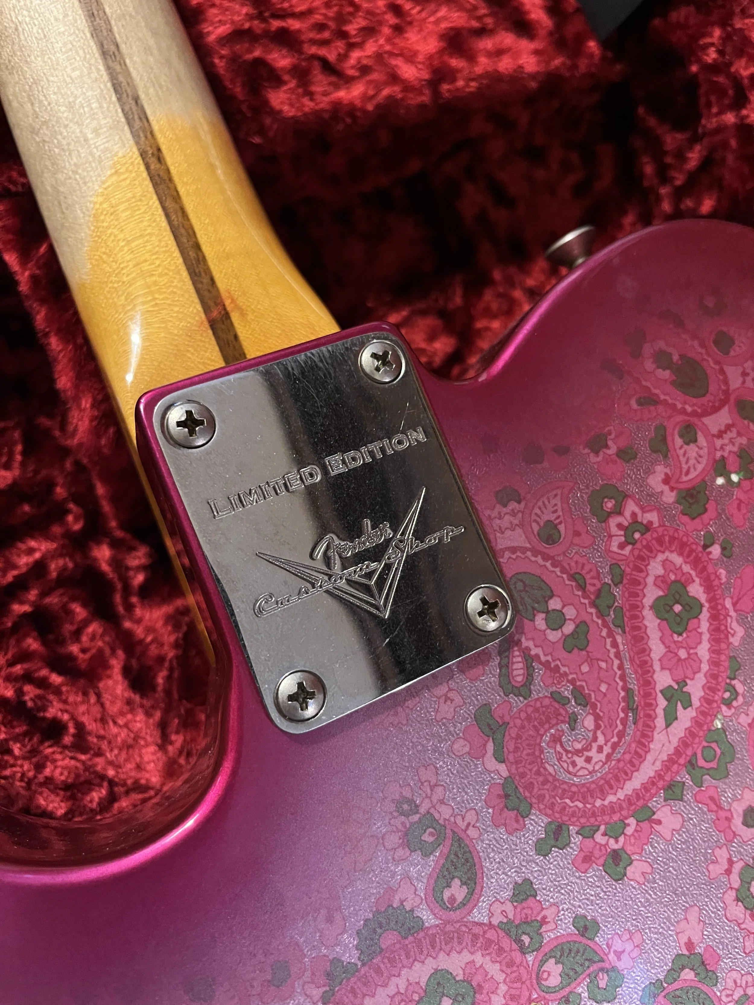 The neck plate saying "limited edition" on a reliced pink paisley Fender Telecaster Thinline 50s.